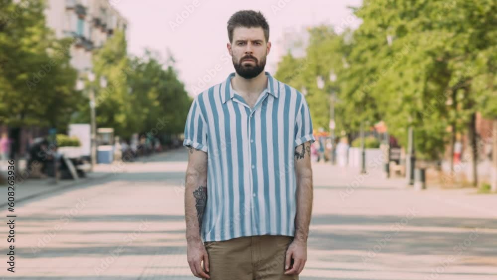 Time lapse portrait of lonely person standing in modern city alone while crowds of people moving around. Youth and urban life concept. Time lapse portrait of lonely person standing in modern city alone while crowds of people moving around. Youth and urban life concept.