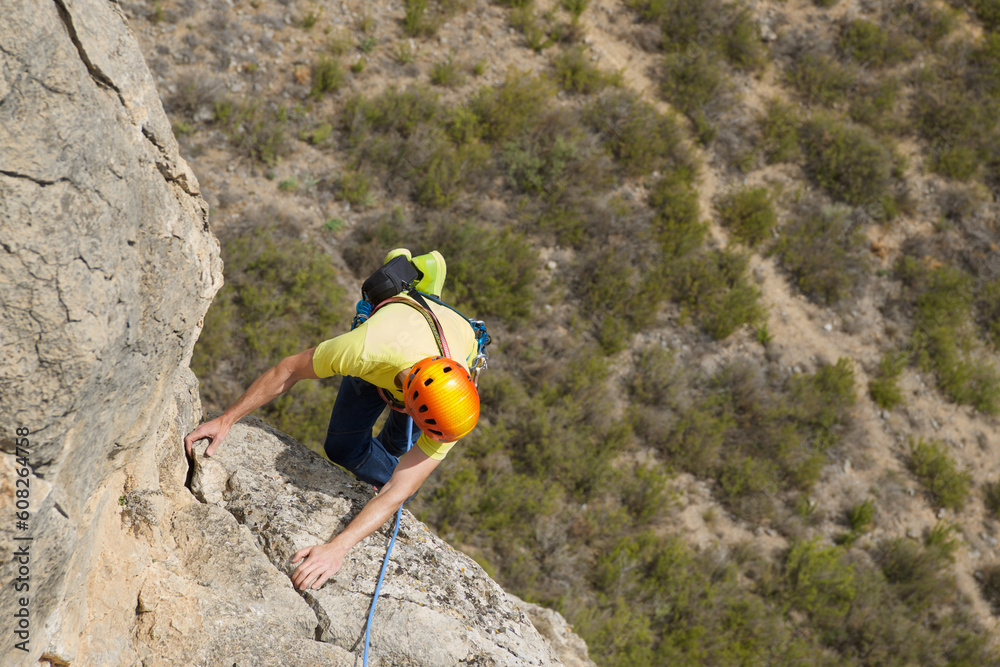 Obraz premium Climbing a stone wall in Spain