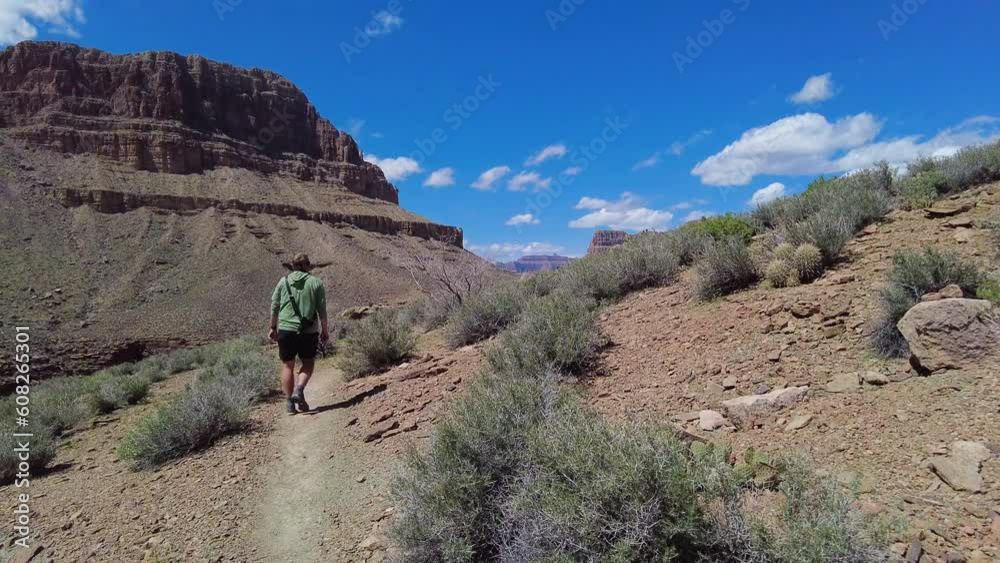 Following Hiker Along Tonto Trail in the Grand Canyon Following Hiker Along Tonto Trail in the Grand Canyon
