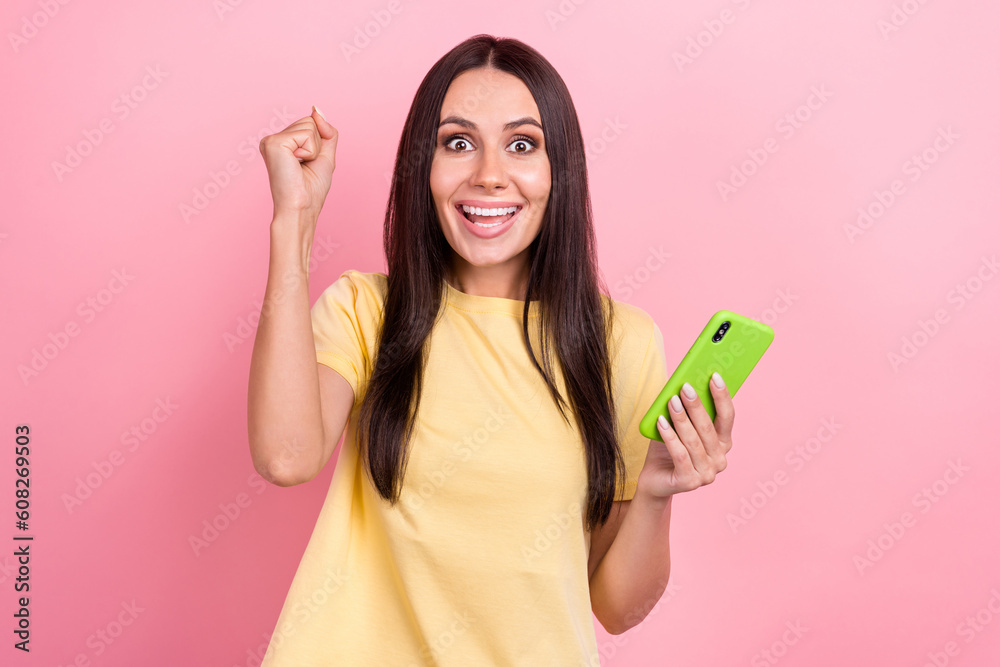 Photo of sweet lucky lady wear yellow t-shirt chatting instagram twitter telegram facebook isolated pink color background Photo of sweet lucky lady wear yellow t-shirt chatting instagram twitter telegram facebook isolated pink color background