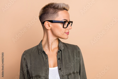 Side avatar photo of young business girl manager hairdress salon advertisement short blonde haircut isolated on beige color background