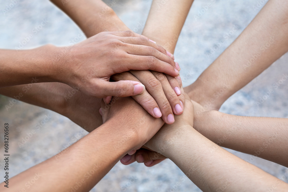 Close-Up, people join hands together. Unity and teamwork concept. Close-Up, people join hands together. Unity and teamwork concept.