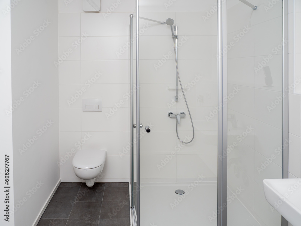 Shower room with chrome faucet, transparent glass doors and shelf. Shower cabin. Shower room with chrome faucet, transparent glass doors and shelf. Shower cabin.