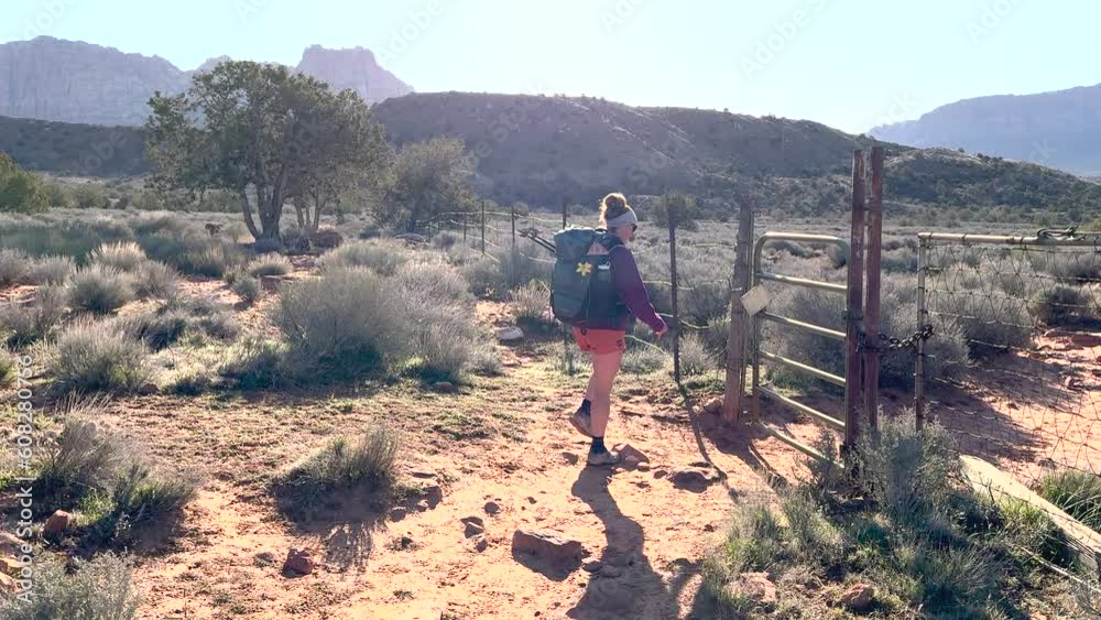Hiker Passes Through Gate In Zion Backcountry Hiker Passes Through Gate In Zion Backcountry