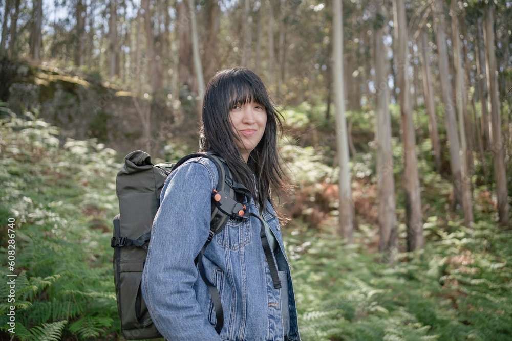 Asian woman walking in the forest Asian woman walking in the forest