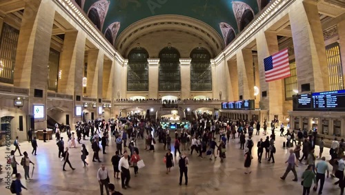 Timelapse of the historic Grand Central Station with crowd of commuters rushing towards the platforms.