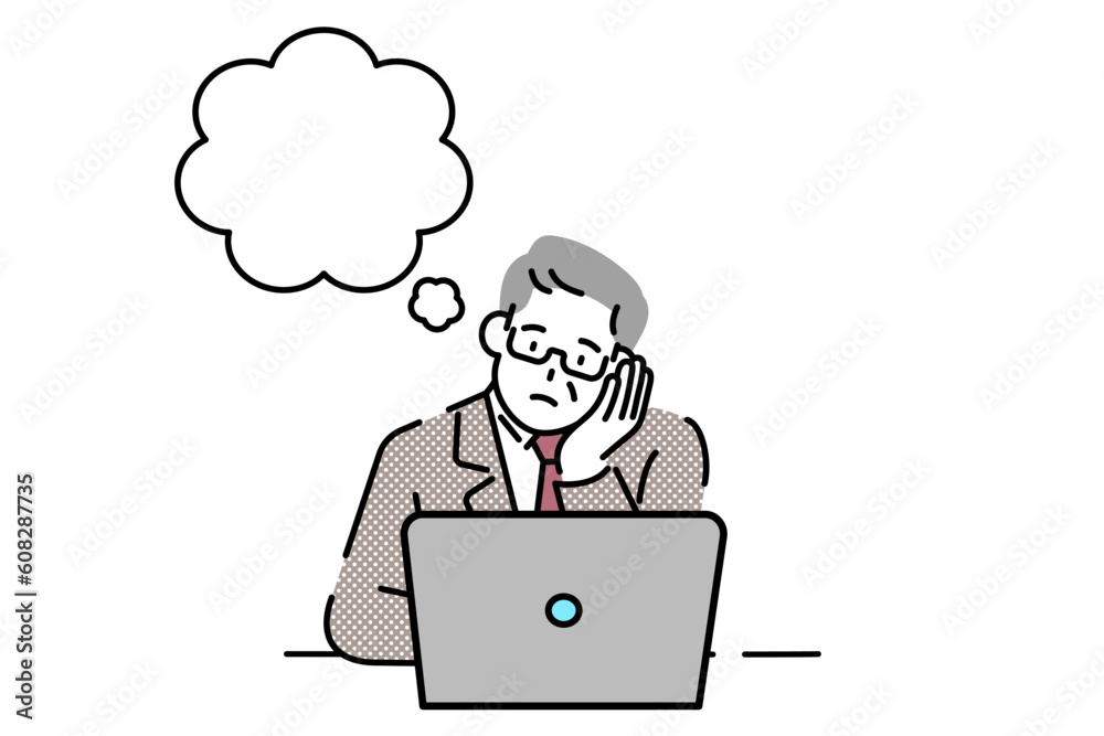 A senior executive sits at his laptop, thinking. A senior executive sits at his laptop, thinking.