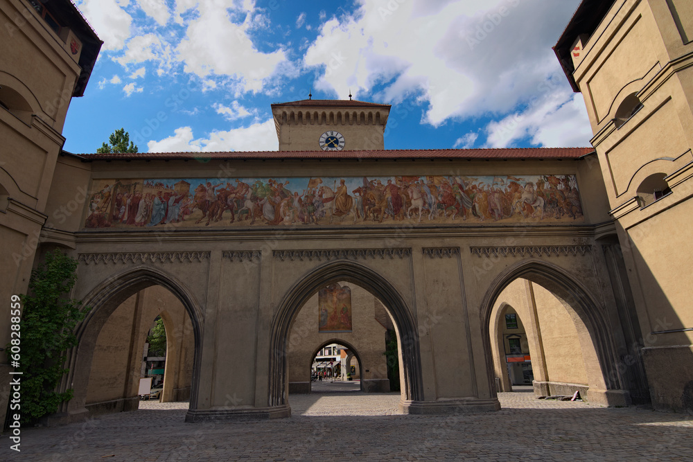 Wide-angle landscape view of the ancient Isartor Gate. Located at the Isartorplatz in Munich, Germany in Munich. It is one of the four gates for entering the medieval city. Travel and tourism concept