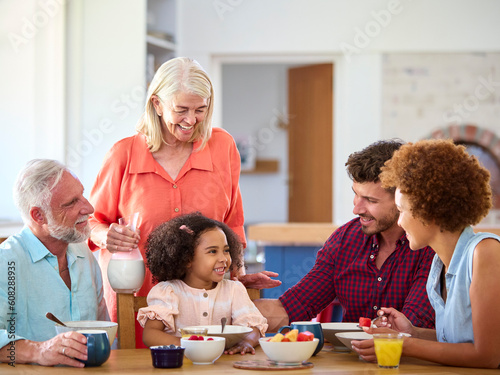 Multi-Generation Family At Home Enjoying Breakfast Together