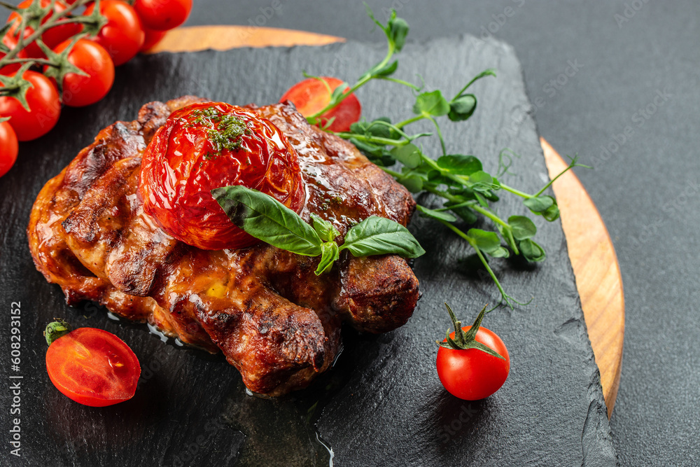 Grilled beef steak on board with tomatoes, Restaurant menu, dieting, cookbook recipe top view