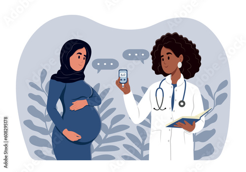 A young smiling black female doctor measures the sugar level of a pregnant woman with a glucometer. Diabetes in pregnant women. World Diabetes Day. Gynecologist and obstetrician consultation.