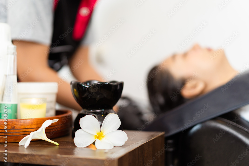 Close up shoot of Asian beautiful woman get hair washing and caring at professional salon shop. Close up shoot of Asian beautiful woman get hair washing and caring at professional salon shop.
