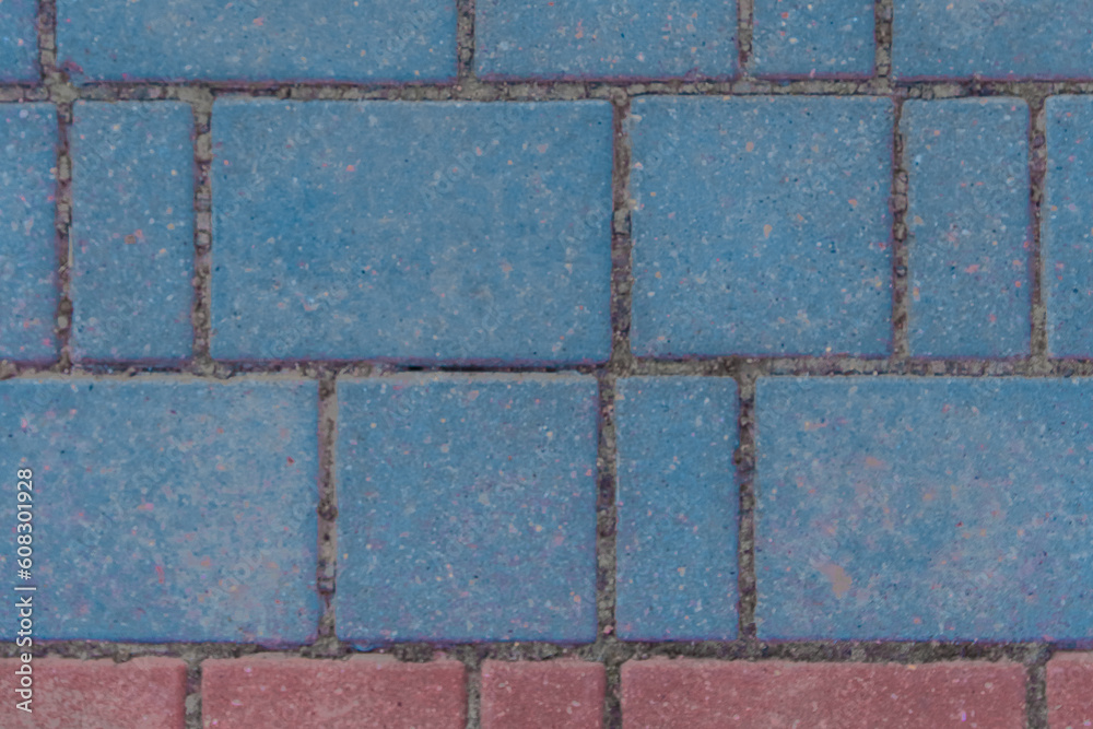 Fototapeta premium Gray sidewalk tile street stone city road abstract urban pattern color red blue pink design texture paving background