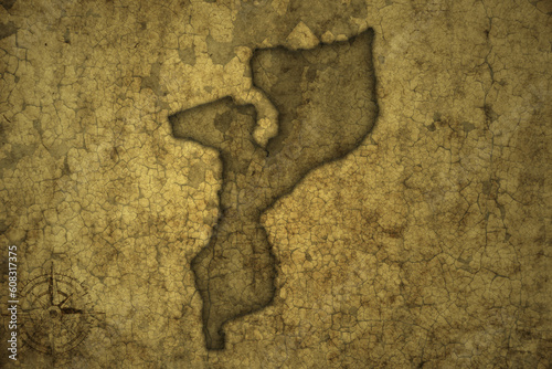 map of mozambique on a old vintage crack paper background .