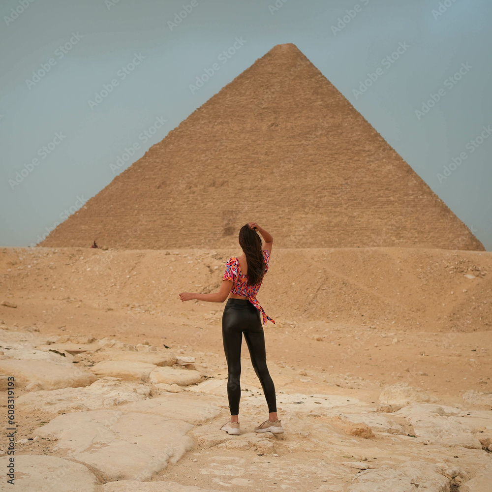 Foto de Tall pretty model girl in leather pants standing in front of ...