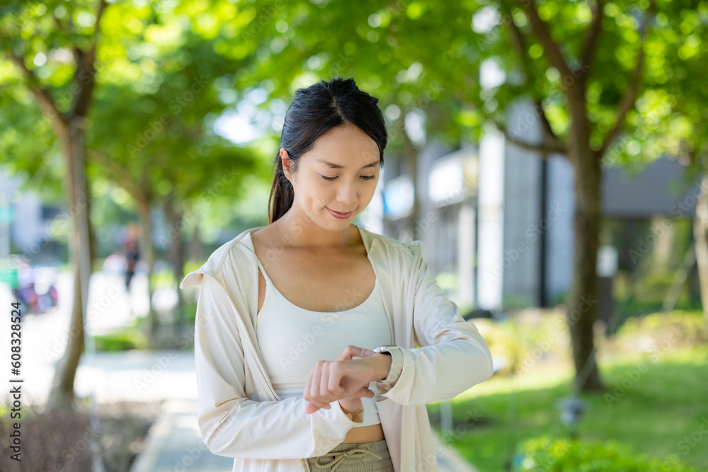 Woman do exercise with her smart watch Woman do exercise with her smart watch
