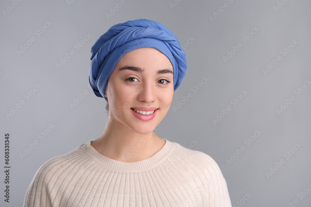 Portrait of smiling woman with cancer on grey background Portrait of smiling woman with cancer on grey background