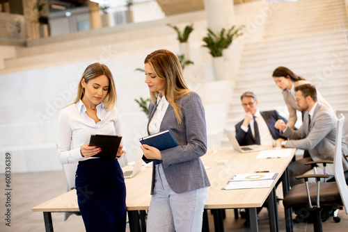 Two young business women lo...