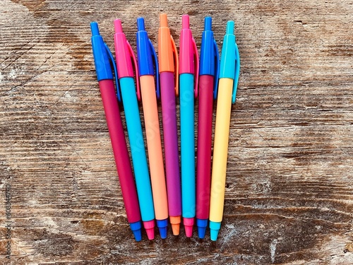 Colorful pencils on wooden table
