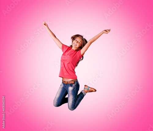 Sporty young woman jumping, exercising