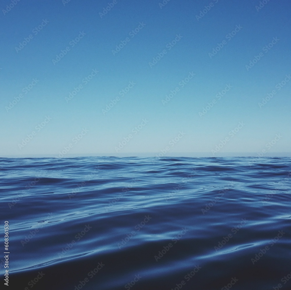 Blue sea with waves, sky and skyline