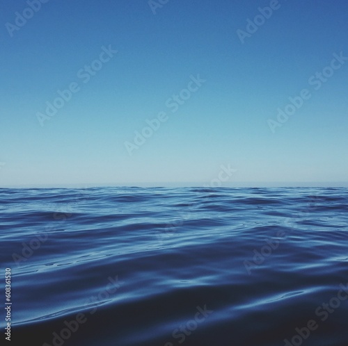 Blue sea with waves, sky and skyline