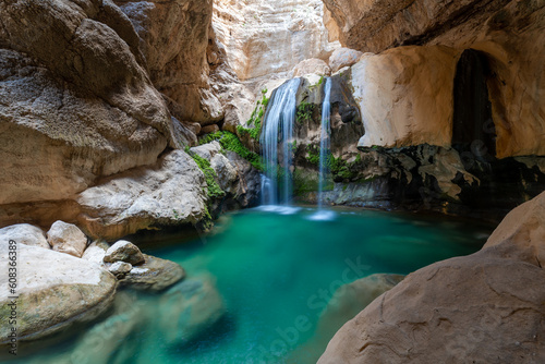 Fototapeta Naklejka Na Ścianę i Meble -  waterfall in huge canyon with azure lake