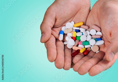Dietary supplement concept, young hand hold pills