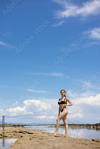 Woman with bikini on the beach (ID: 608371966)