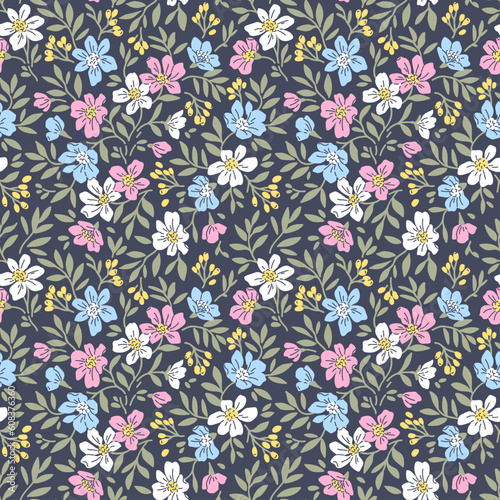 Beautiful floral pattern in small retro flowers. Small pink and blue flowers. Dark violet background. Ditsy print. Floral seamless background. Stock vector for printing on surfaces. Vintage flowers.