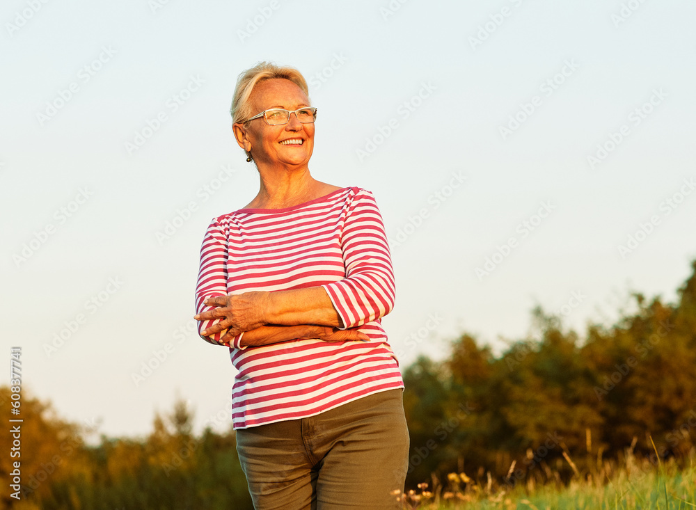 portrait senior woman elderly old retirement mature gray hair outdoor healthy active retired happy