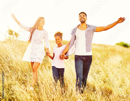 child daughter family happy mother father running active healthy carefree fun together girl cheerful field outdoor nature summer