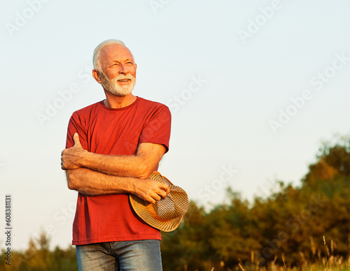 portrait senior man elderly old retirement mature gray hair farm farmer outdoor healthy active retired hat