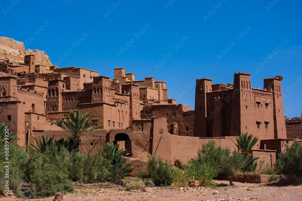 View to the old moroccan town. Wall and towers made from red clay