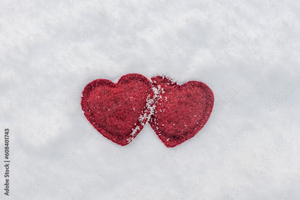 cute red hearts together on white fluffy snow, love concept, valentines day card.