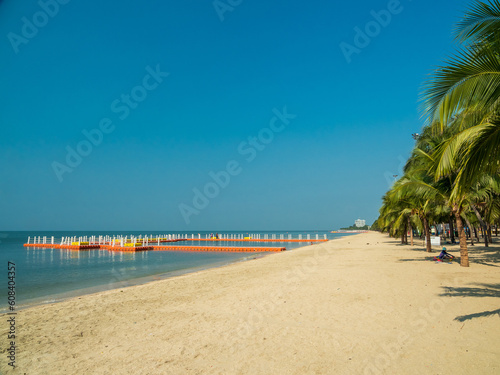 Landscape summer panorama front view tropical palm and coconut trees sea beach blue white sand sky background calm Nature ocean Beautiful wave water travel Bangsaen Beach East thailand Chonburi