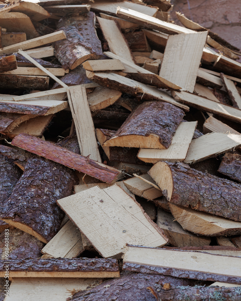 wooden firewood for fireplace and heating of country house. harvesting of wood for cold winter season. no people photo of textured wood chips, closeup. garden farm wooden firewood for fireplace and heating of country house. harvesting of wood for cold winter season. no people photo of textured wood chips, closeup. garden farm