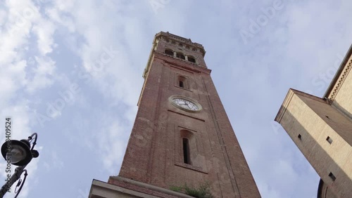 Ancient clock tower with clouds in the background