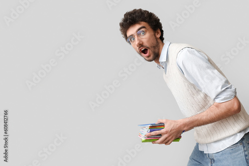 Male student with copybooks...
