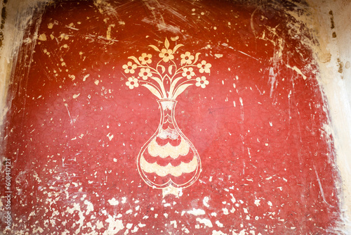 Mural painting with flowers in a vase on a red worn wall, Bundi palace, Bundi, Rajasthan, India, Asia photo