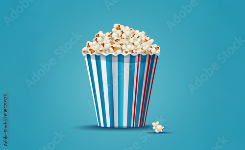 Baked Butter Popcorn into a blue striped paper cup, roasted Butter Corn Kernels Mixed with natural salt, Appetizers in the cinema or party,  Created using generative AI tools. © © Raymond Orton