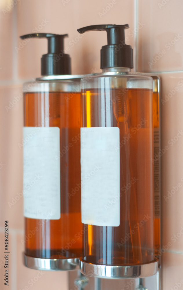 Two bottles with shampoo, shower gel. Soap 
