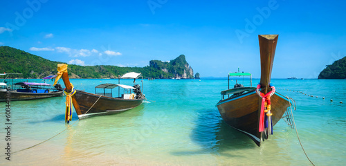 Traditional longtail boats near beautiful tropical island Ko Phi Phi, Thailand