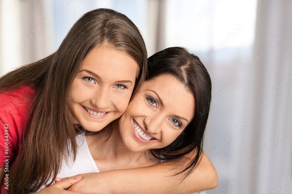 Smiling happy young women posing at the camera Smiling happy young women posing at the camera