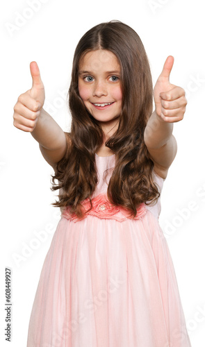 Cheerful happy little girl showing thumb up