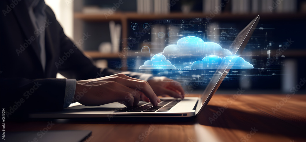 Close up of a businessman hand typing on a laptop with cloud technology graphs projecting of the screen