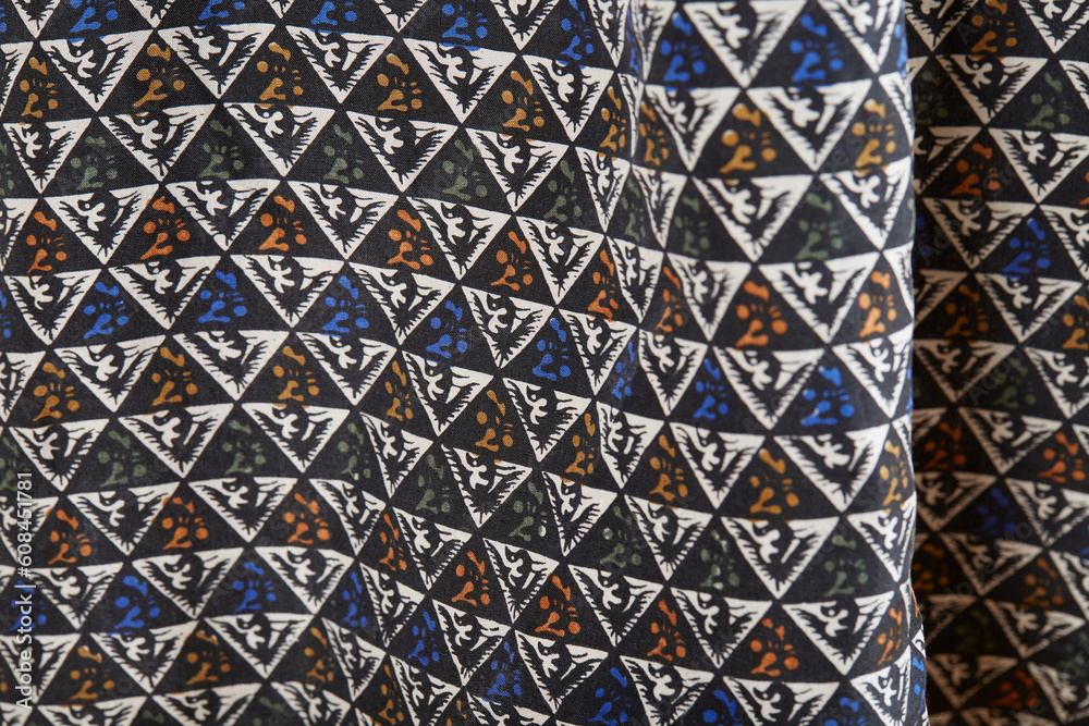 Geometric pattern fabric from a men's silk button-down shirt. Geometric pattern fabric from a men's silk button-down shirt.