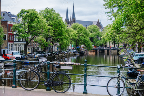Photography Amsterdam bridge over canal, with parked bicycles