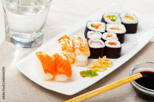 Various of sushi traditionally served with pickled ginger, wasabi and soy sauce. Japanese cuisine. High quality photo