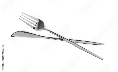 Fork and knife isolated on white  top view. Stylish shiny cutlery set